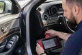 CarSherpa professional diagnostic scanner checking the real electronic mileage of an imported used car in Hungary to prevent odometer rollback scams.